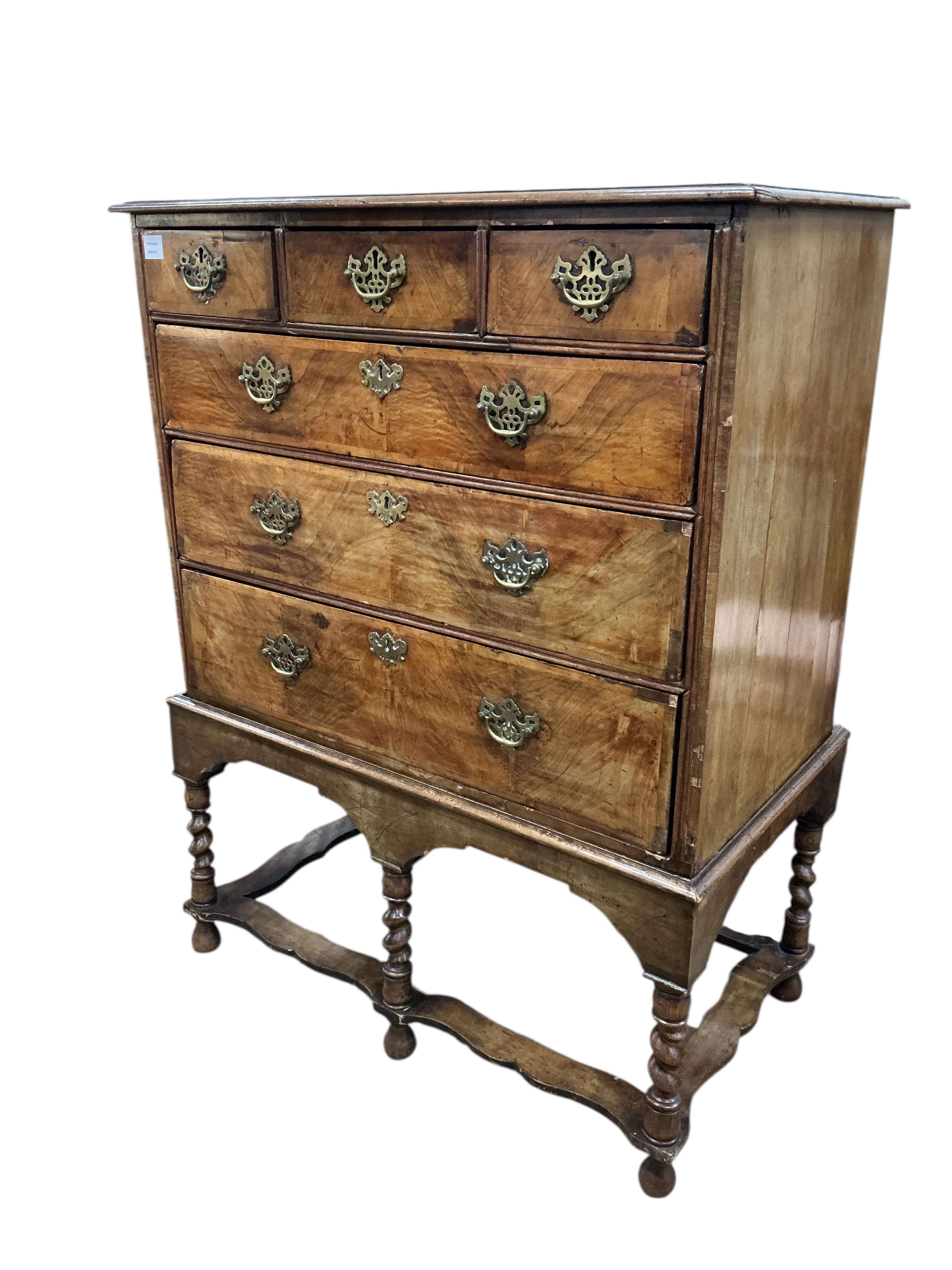 An 18th century banded walnut chest on stand, width 99cm, depth 54cm, height 128cm